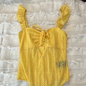 Yellow body suit